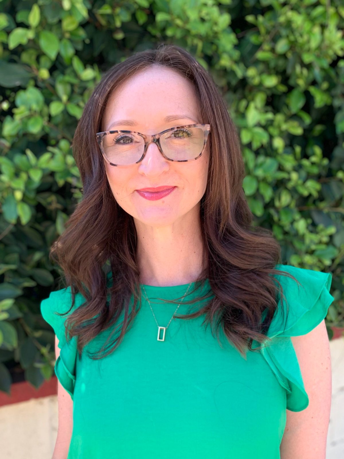 LaurenDowden_LCSW – Lauren Dowden a person wearing glasses and smiling at the camera
